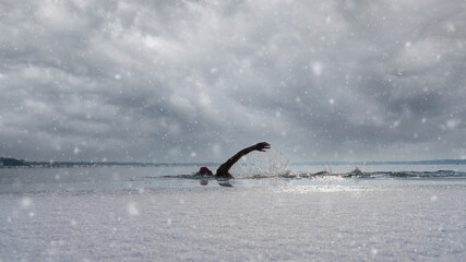 Ice swimming in a frozen lake in winter