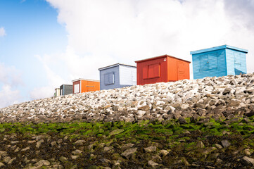 Colorful beach houses and bathhouses on the dike of Dagebüll