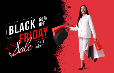 Beautiful young woman with shopping bags. Black Friday sale