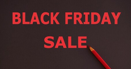 Black Friday advertisement handwritten with pencil on dark backgorund , Black Friday sale concept