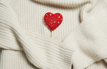 Decoration with a red heart and a sweater