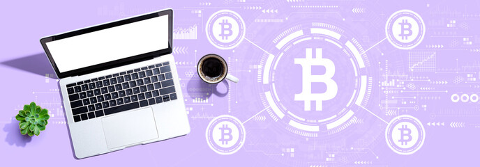 Bitcoin theme with a laptop computer on a desk
