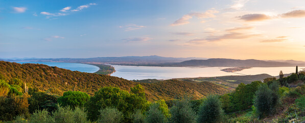 Sunrise landscape at Orbetello lagoon natural park, beautiful sky scenic coast aerial view from Monte Argentario, tourism destination Tuscany Italy