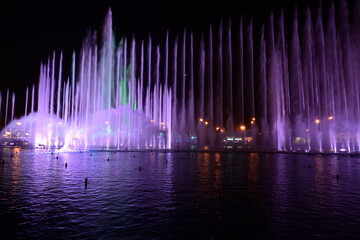 Blue colors in its degrees on the water of the dancing fountain in Riyadh Boulevard