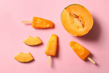 Tasty melon popsicles on color background
