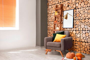 Cozy armchair in room decorated for Halloween