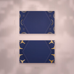 Business card template in dark blue with vintage gold ornaments for your personality.