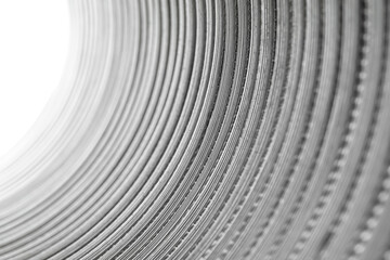 Flexible corrugated aluminum tube seen from the inside, resistant to high temperatures, isolated on...