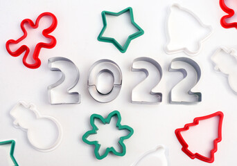 Plastic and metal cookie cutters on the New Year theme and numbers compiled -2022.