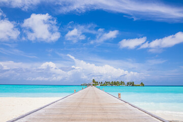 A pier on a paradise island with azure water and exotic vegetation