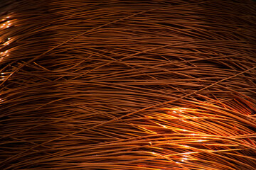 Enameled copper wire wound on a large spool.