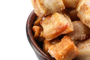 Bowl with tasty cracklings on white background, closeup