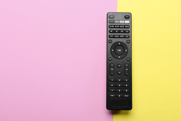 Modern TV remote control on color background