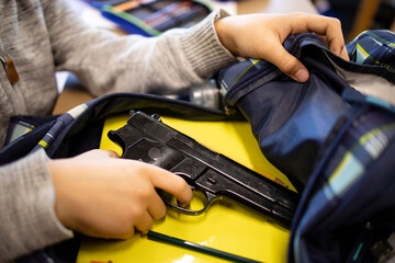 Fototapeta Active shooter taking gun in classroom ready for mass school shooting. obraz