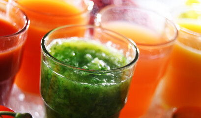 Glasses with fresh organic vegetable and fruit juices