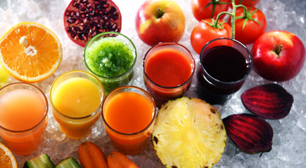 Glasses with fresh organic vegetable and fruit juices