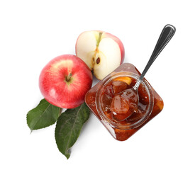 Tasty apple jam and spoon in glass jar near fresh fruits on white background, top view