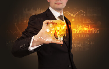 Businessman holding a lightbulb concept