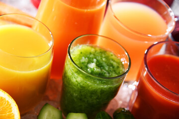 Glasses with fresh organic vegetable and fruit juices