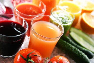 Glasses with fresh organic vegetable and fruit juices