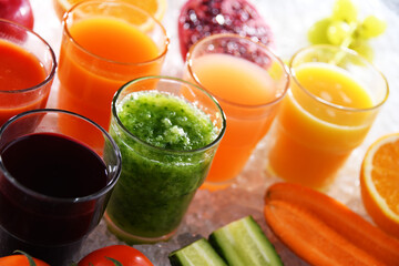 Glasses with fresh organic vegetable and fruit juices