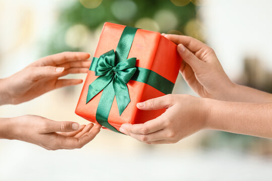 Women With Small Gift Box At Home On Christmas Eve, Closeup