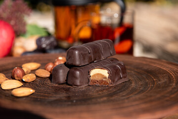 Chocolate on the brown plate. Copy space. Close up.Sunshine outside. 