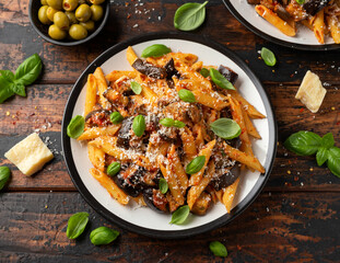 Pasta alla Norma with eggplant or aubergine, tomato, parmesan and basil. Healthy food