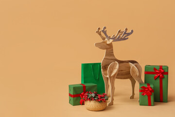 Wooden reindeer with Christmas presents and rowan on beige background