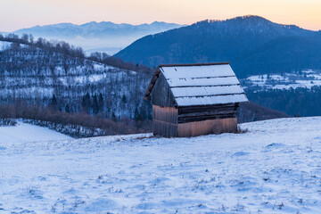 Winter landscape with hayloft in Velka Fatra, Slovakia