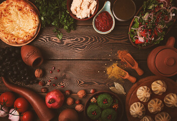 Traditional Georgian table, top view, Khinkali, Phali, Shoti, Khachapuri, Sauces, Fruits, nuts, Salad, cheese, horizontal, no people,