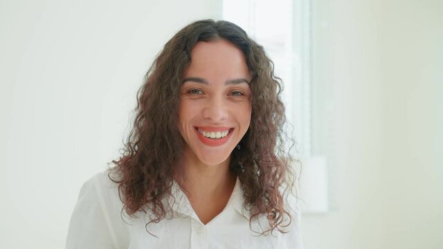 Portrait of Latino Beautiful girl in pajamas smile and look at camera.	
