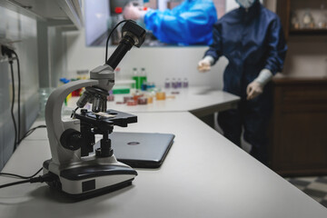 Microscope on table for science background. Medicine, pharmacist. glass jars, flasks and tools, Selective focus. Copy space