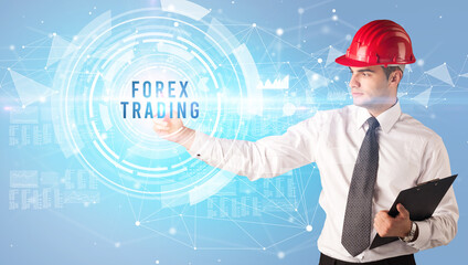 Handsome businessman with helmet drawing