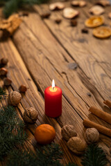 Traditional Czech Christmas on wood decoration with twig, candle, apple, orange, fruit