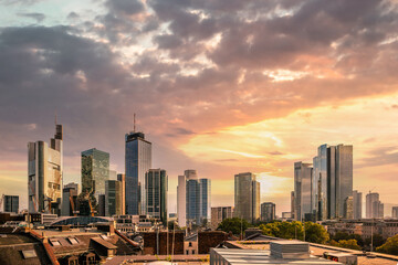 Skyline view from a viewing platform. Frankfurt am Main in Germany in the evening with a dreamlike sunset in the middle of the skyline. Great city photo of the financial district - obrazy, fototapety, plakaty