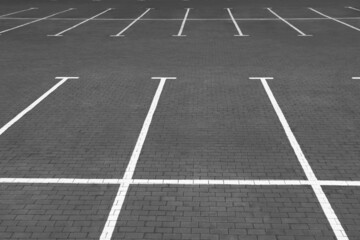 Empty car parking lots with white marking lines outdoors