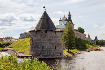 Stone tower and Pskov Kremlin fortress wall at the confluence of two rivers, Russia