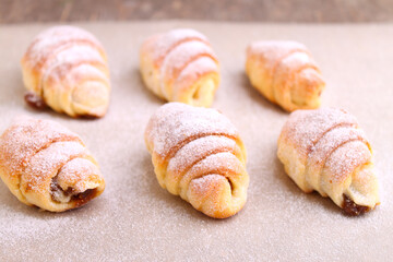 Cookies bagels with jam in powdered sugar.