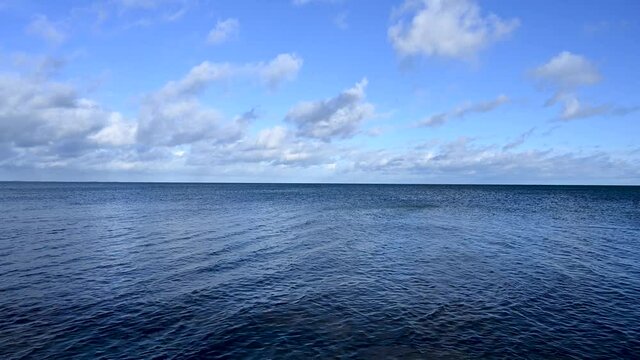 Blue sea water and blue sky. Baltic sea, Germany. Soft waves on the water. 