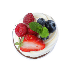 Sweet cupcake with fresh berries isolated on white, top view