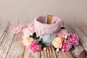 basket made of wood, decorated with peonies. basket for a newborn photo shoot. maroon peonies 