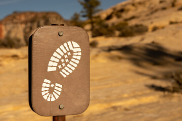 Footprint Sign Leads Hikers Along the West Rim Trail