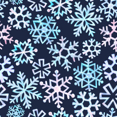 Watercolor seamless pattern of light blue and light pink snowflakes. Dark blue background. Winter, New Year pattern.

