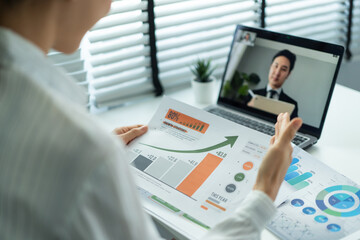 Asian young business people use laptop computer video call in office. 