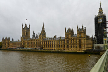 Fototapeta na wymiar Houses of Parliament with the Elizabeth Tower still wrapped in scaffolding