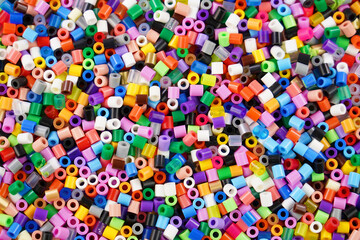 Multicolored plastic beads toy for kids . Full frame backgraunds image.