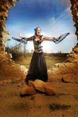 Mysterious woman sorcerer ready to fight in ruins by power and spell