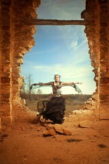 Mysterious woman sorcerer ready to fight in ruins by power and spell