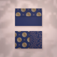 Dark blue business card template with vintage gold pattern for your contacts.